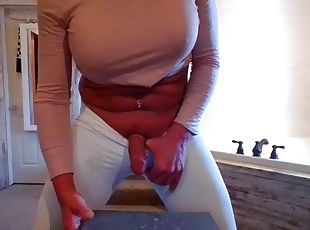 Sexy hot crossdresser with big tits in leggings eats cum