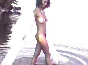 Retro porn video of a hot brunette with big natural boobs