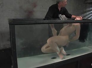 Poor brunette lust is being immersed in the tank