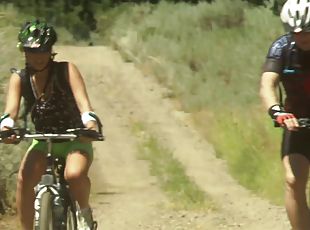 Pair of bicycle riders having doggy style sex deep in the wilderness