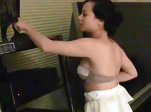 Naughty Aurora takes her dress and bra off to show tits
