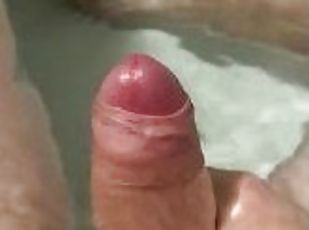 Stroking my cock in the bath