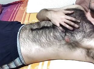 A very hairy man gives a soft dick massage and touches his hairy chest with a big bulge