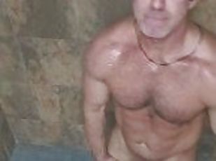Jock rubs cum on oiled body in gym shower after work out