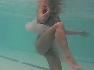 Sheer white dress on a teen swimming in the pool