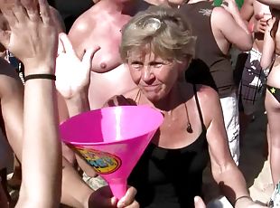 Doting amateur shows off her nice ass close up at a saucy beach party