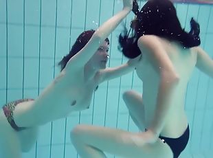 Mia And Petra Undress Eachother In The Swimmingpool
