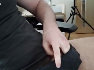 Bearded college stud wanks at computer desk and plays with leaking precum from his big cut cock