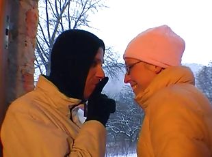 Girlfriend with glasses gives outdoor blowjob on a snowy day