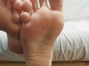 Gentle soles scrunching with bare legs and feet
