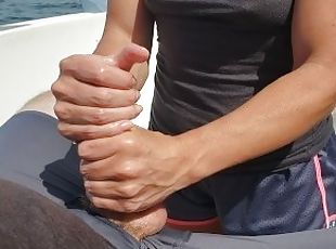 Relaxing on the back deck and busting a handjob nut on the open seas.