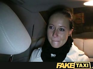 A brunette girl gets fucked fucked in a missionary pose in a car