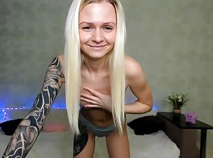 Skinny tattoo blonde is showing her hot body with impressive tattoo
