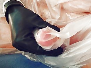 Getting hard while posing in plastic gown and latex gloves 