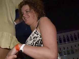 Curly-haired skank flashes her natural tits at a party