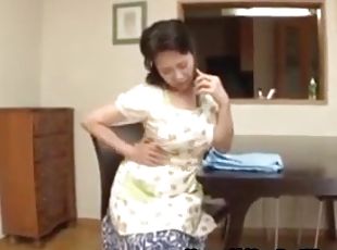Asian housewife caught masturbating in the kitchen