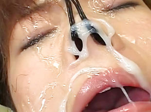 Cute Asian babe with gag in mouth gets sperm