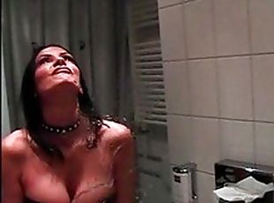 Sexy chick spitting on a mirror