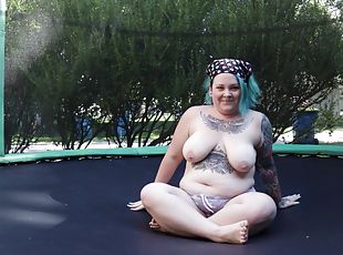 Fat Tattooed Milf Jumping and Stripping on a Trampoline