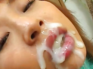 Asian schoolgirl being covered with sperm