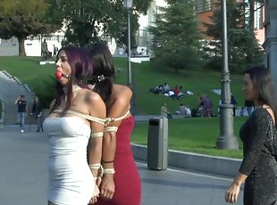 Coral Joice and Julia De Lucia tied up in public with ball gags