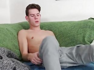 Skinny twink in a sweater strips and strokes his cock